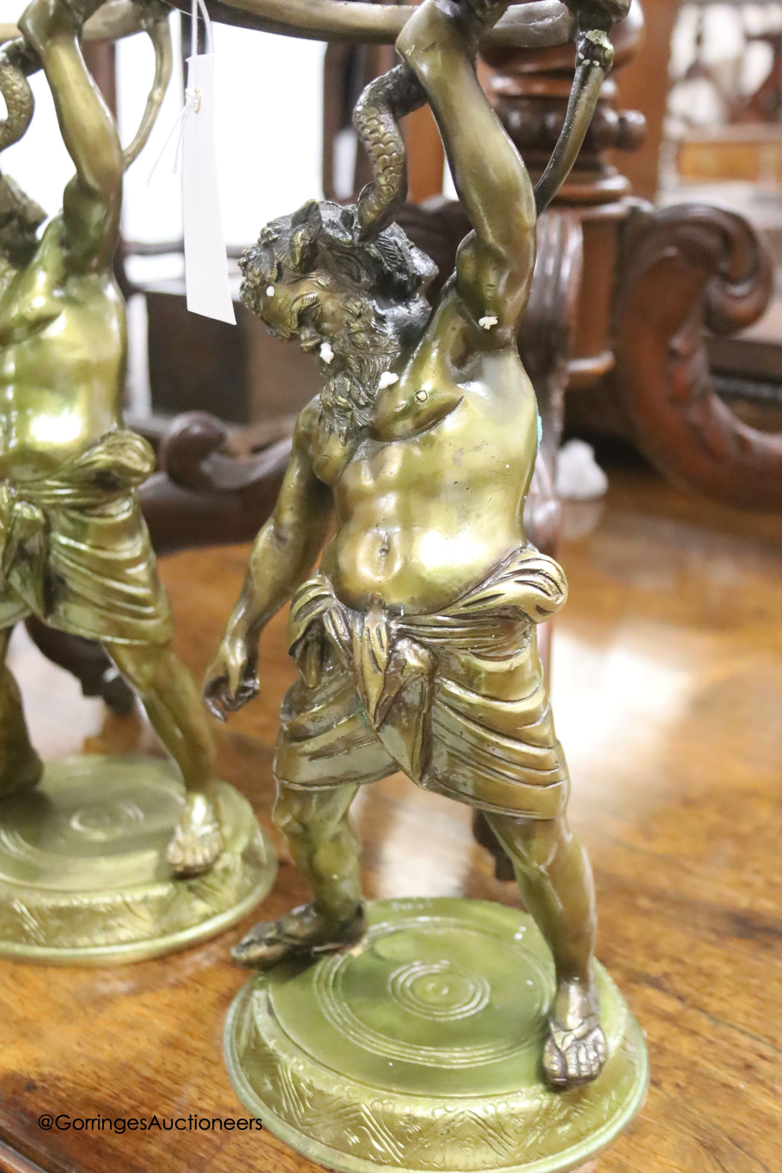 Six cast gilt metal figures of Hercules, height 42cm